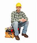 young handyman sit on his toolbox isolated on white