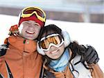 Lucky couple  snowboarders  in a mountain
