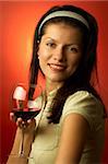 young pretty caucasian woman with wine over red
