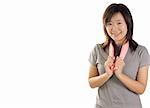 Asian sport girl holding pink tower showing beautiful smile on white background with copy space.