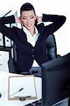 Relaxing business woman at her bay over white background