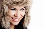 Adorable young woman smiling with a fur hat