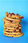 chocolate chip cookie stack on blue vertical