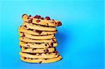 chocolate chip cookie stack on blue