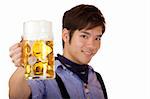 Asian man holding an Oktoberfest beer stein into camera and smiles. Focus on beer stein. Isolated on white.