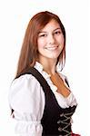 Young beautiful Bavarian woman wearing original Dirndl dress for the Oktoberfest in Munich. Isolated on white background.