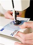 Euro bank note in the sewing machine