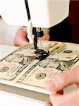 Ten dollar bank notes in a sewing machine