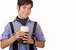 Asian man holding an Oktoberfest beer stein in front of his chest and smiles friendly. Isolated on white.