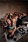 Cute lady DJ at a 1970s Disco Music Party