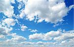 blue sky background with tiny clouds