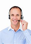 Self-assured mature businessman using headset against a white background