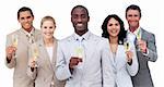 Portrait of multi-ethnic business team drinking champagne against a white background