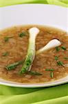 Freshly made traditional healthy onion soup on a plate