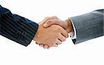 Close-up of a business people shaking hands against a white background