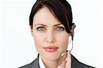 Charismatic businesswoman using headset on in a call center