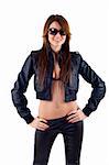 Sexy brunette wearing sunglasses and leather outfit over white