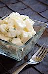 Delicious creamy potato salad dressed in mayo infused with parsley.