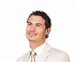 Young businessman with headset on looking up against a white background