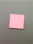 Pink Adhesive Note on grey background