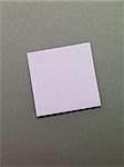 Purple Adhesive Note on grey background