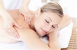 Beautiful woman receiving a back massage in a Spa center