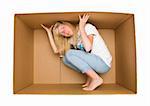 Young Woman inside a Cardboard Box isolated on white Background