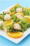 Chicken salad with fresh lettuce and oranges
