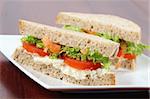 Vegetarian sandwiches with egg spread, lettuce, tomatoes and carrots