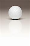 Single White Golf Ball on a Gradated White Background.