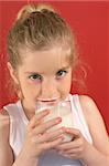 girl drinking milk with milk mustache