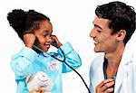 Smiling doctor and his patient playing with a stethoscope against a white background
