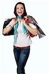 A very beautiful, casual and happy girl holding shopping bags and laughing. Isolated on white.