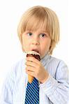 Little boy eating ice cream. Child isolated on white