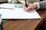 Close-up of a female student doing her homework at home