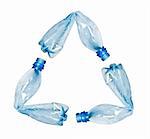 three blue plastic water bottles bent and put together to make up recycle symbol. Objects isolated on white, no shadow