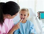 Close-up of a doctor examining patient's throat in the hospital