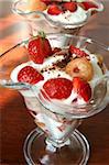 Refreshing yogurt dessert with strawberries and yellow raspberries