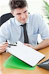 Confident businessman showing a contract to a customer in the office