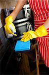 Close-up of a caucasian woman doing housework in the kitchen