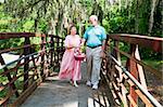 Beautiful senior couple with picnic basket, on Florida vacation.