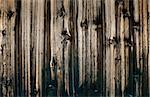 Fragment of an abstract wooden wall close up