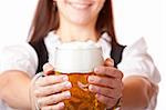 /Closeup macro of Oktoberfest beer stein with woman in babackground. Isolated on white.