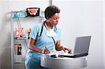 Cute afro-american doctor at her office