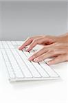 woman hands typing keyboard on desktop