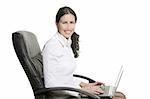 Brunette business woman typing laptop computer on office chair