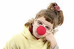 sad clown nose little girl with big glasses posing portrait on white