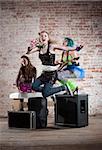 Young all girl punk rock band performs in a warehouse