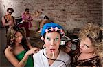 Funny woman in curlers teased at a 1970s Disco Music Party