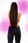 Back of young woman with long hairs dressed in jeans